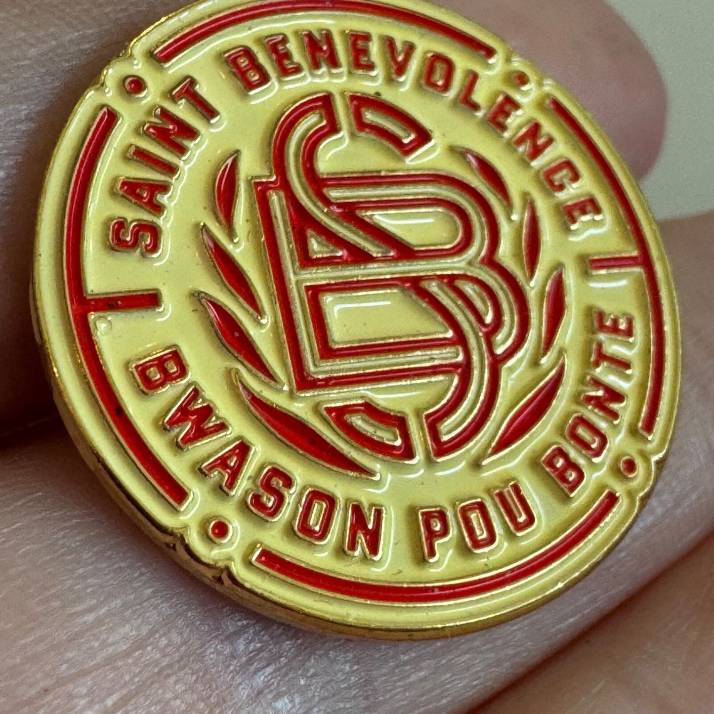 Saint Benevolence Rum Haiti “Bwason Pou Bonte” Red & Gold Logo Pin