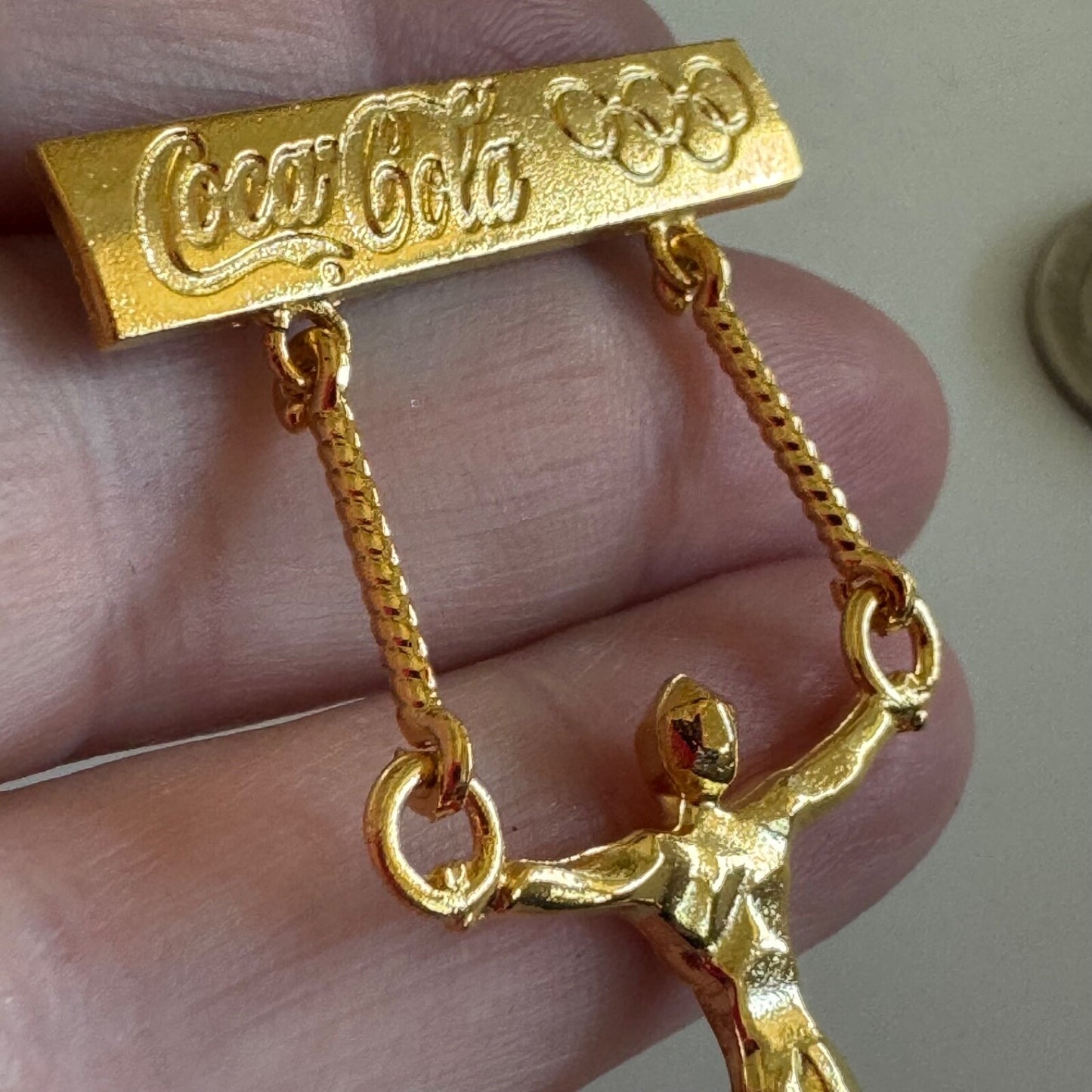 Vintage Gold Tone Coca Cola Mens Gymnastics Rings Olympics Lapel Pin