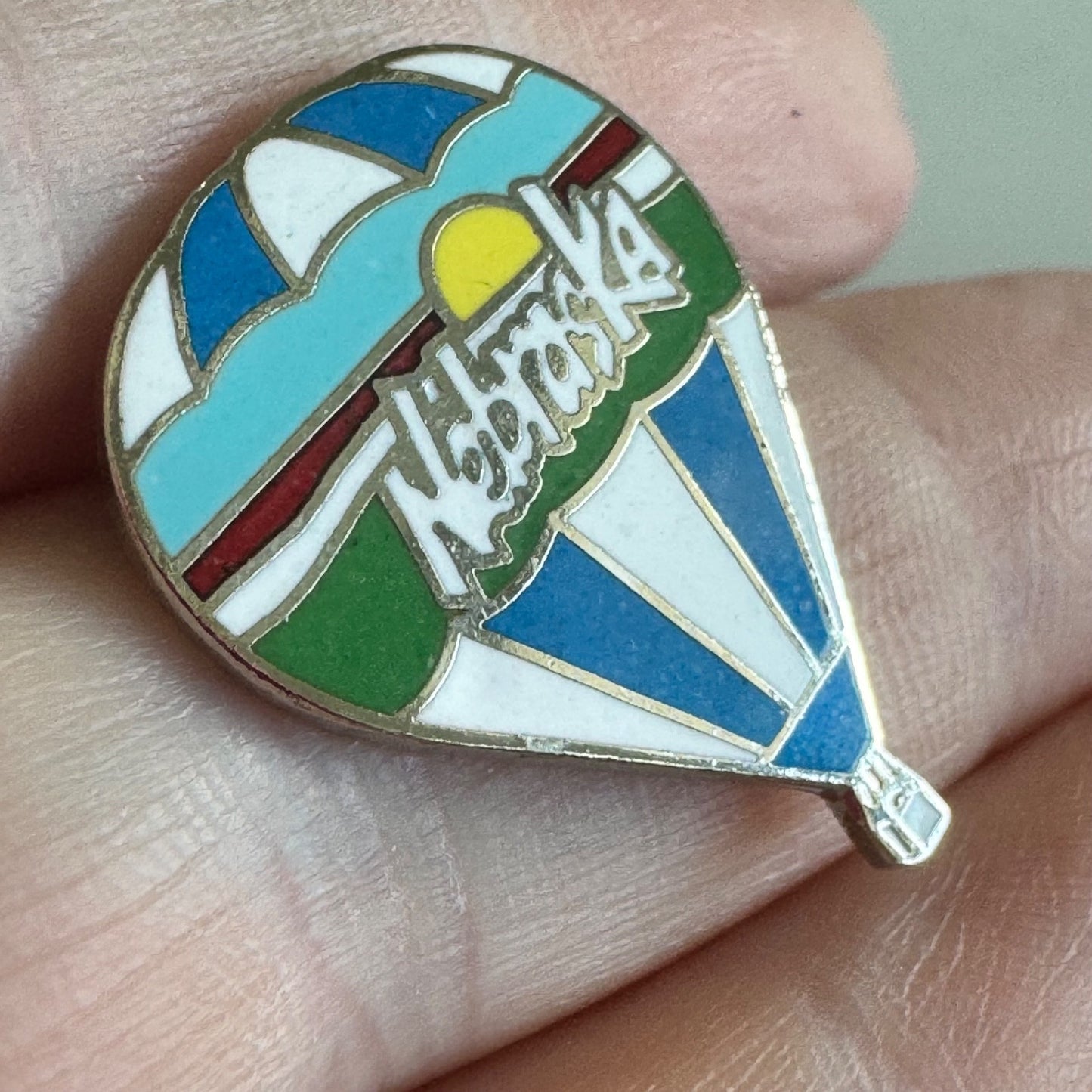 Nebraska Hot Air Balloon Enamel Pin – State Souvenir with Sun