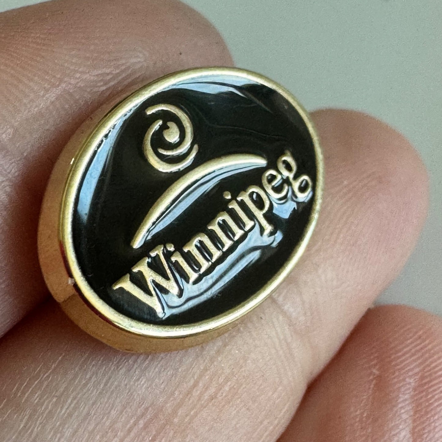 Vtg Winnipeg Canada Spiral Wave Crest Enamel Oval Lapel Pin Tie Tack Black Gold