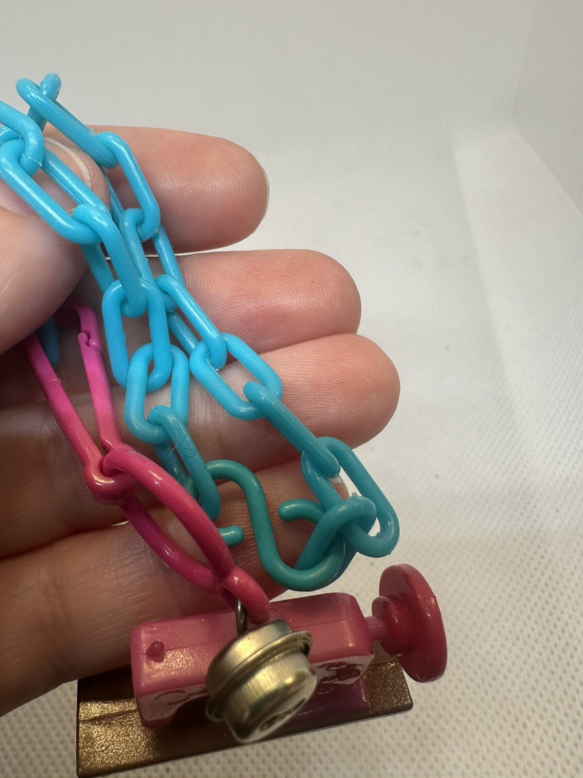 Vintage 1980s Plastic Bell Charm Pink Sewing Machine Charm Plus Blue Bracelet