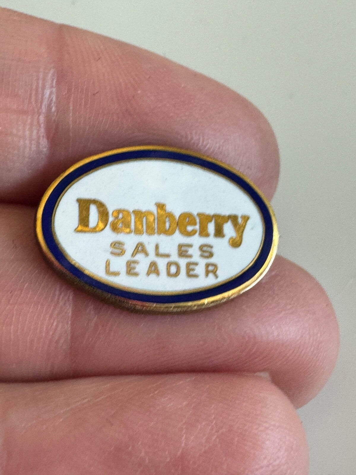 Vintage Danberry Sales Leader Award Pin – White Enamel Real Estate Badge