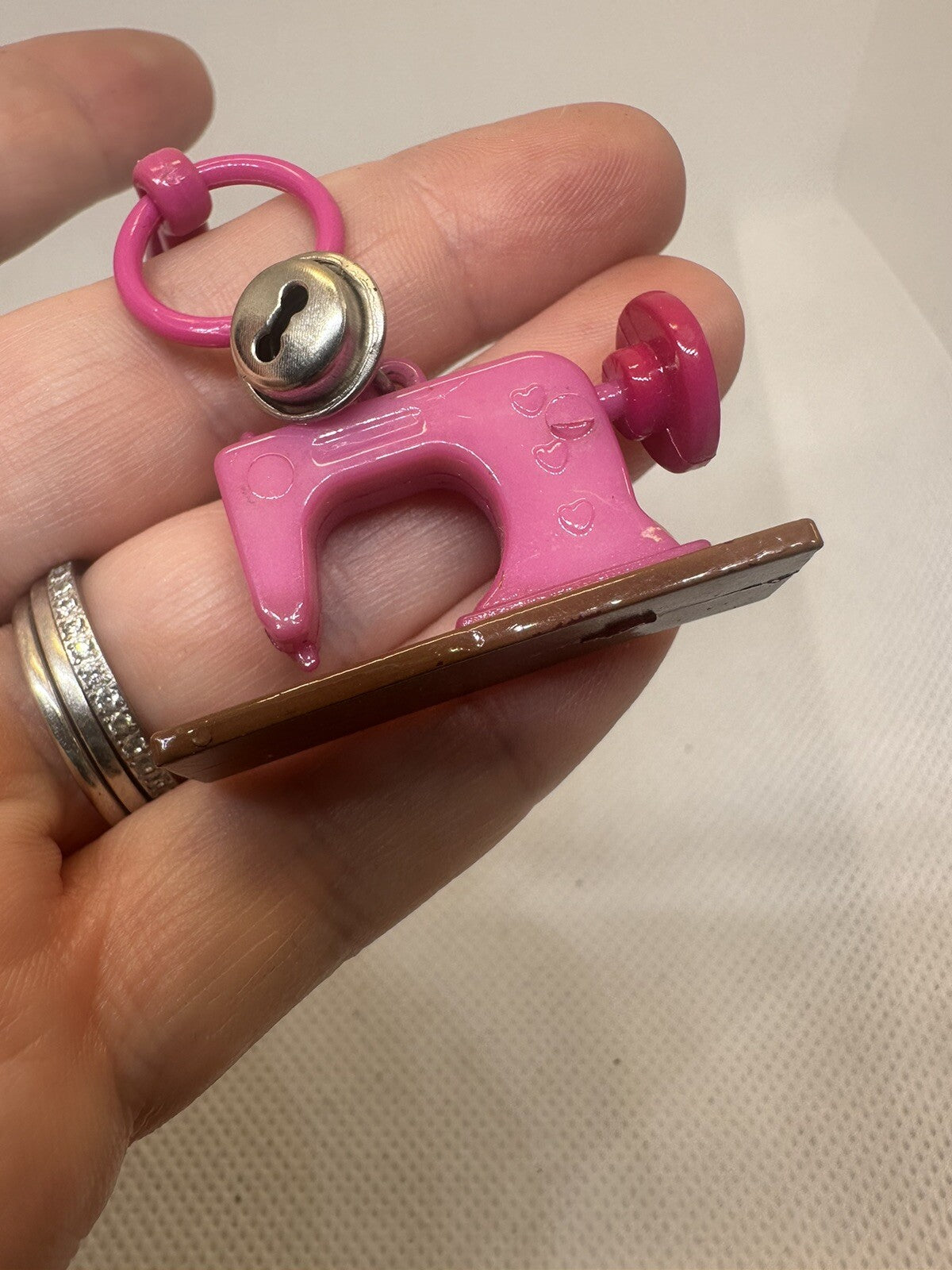 Vintage 1980s Plastic Bell Charm Pink Sewing Machine Charm Plus Blue Bracelet