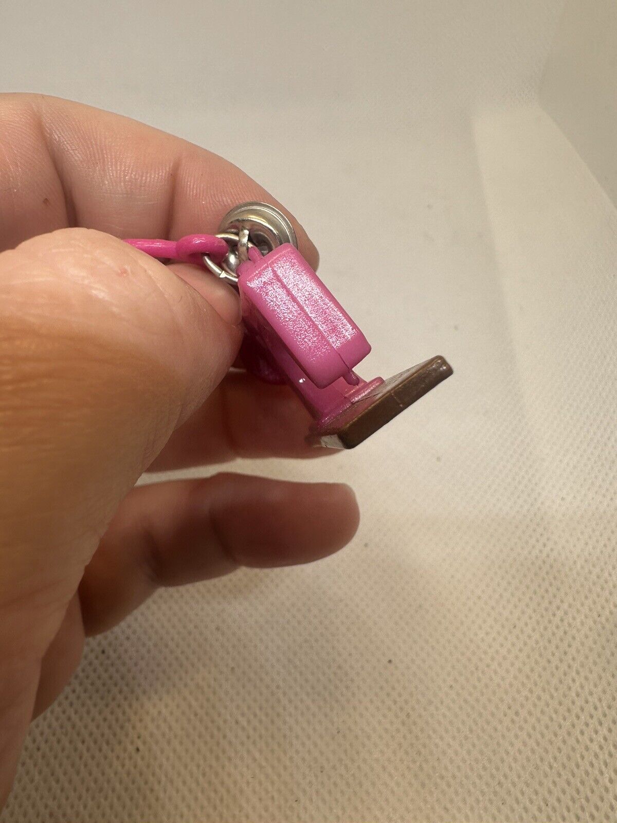 Vintage 1980s Plastic Bell Charm Pink Sewing Machine Charm Plus Blue Bracelet