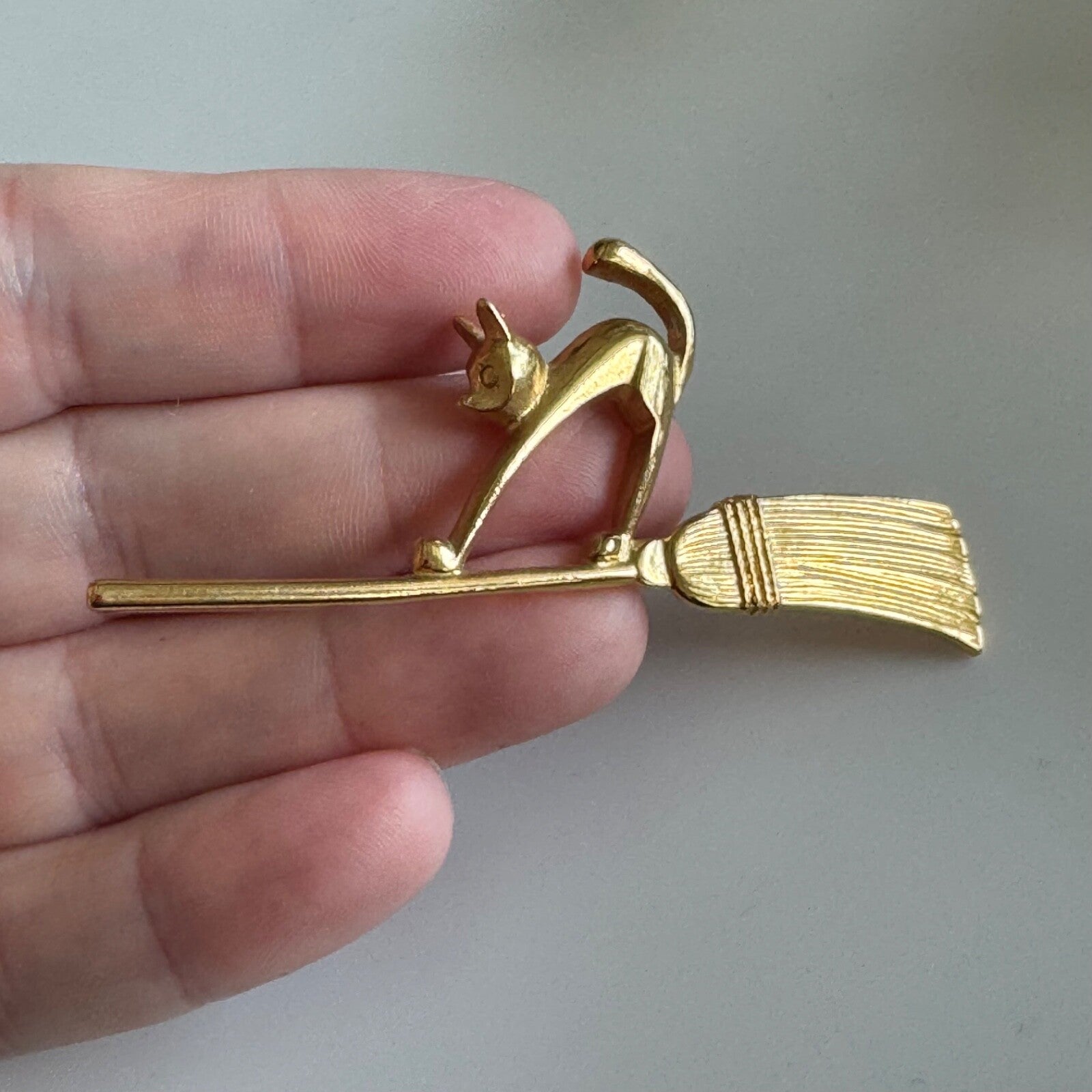 Vintage Avon Halloween Bewitching Cat on Broom Flying Gold Tone Lapel Pin