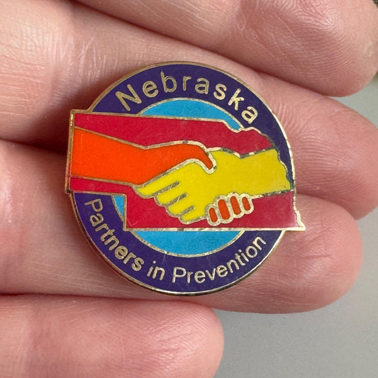 Nebraska Partners in Prevention Enamel Pin Handshake Design 