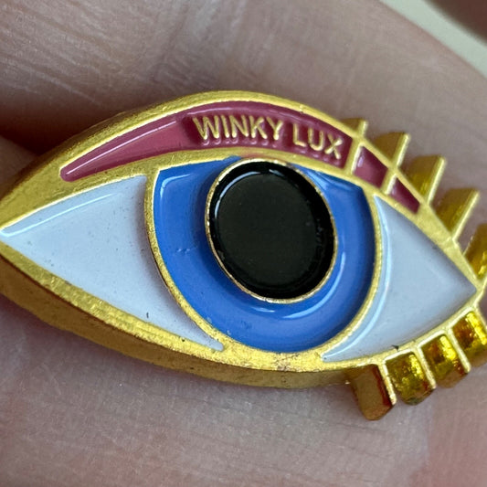 Winky Lux Eye Enamel Lapel Pin Gold Tone Advertising Makeup Eye Shadow