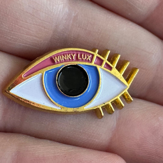 Winky Lux Eye Enamel Lapel Pin Gold Tone Advertising Makeup Eye Shadow
