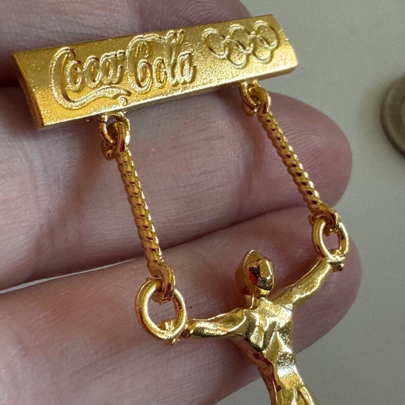 Vintage Gold Tone Coca Cola Mens Gymnastics Rings Olympics Lapel Pin