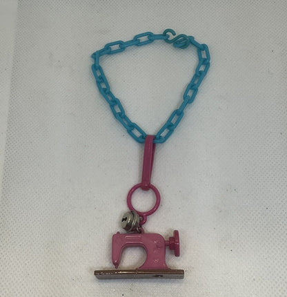 Vintage 1980s Plastic Bell Charm Pink Sewing Machine Charm Plus Blue Bracelet