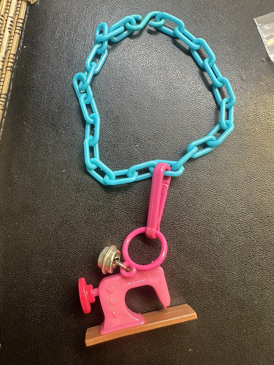 Vintage 1980s Plastic Bell Charm Pink Sewing Machine Charm Plus Blue Bracelet