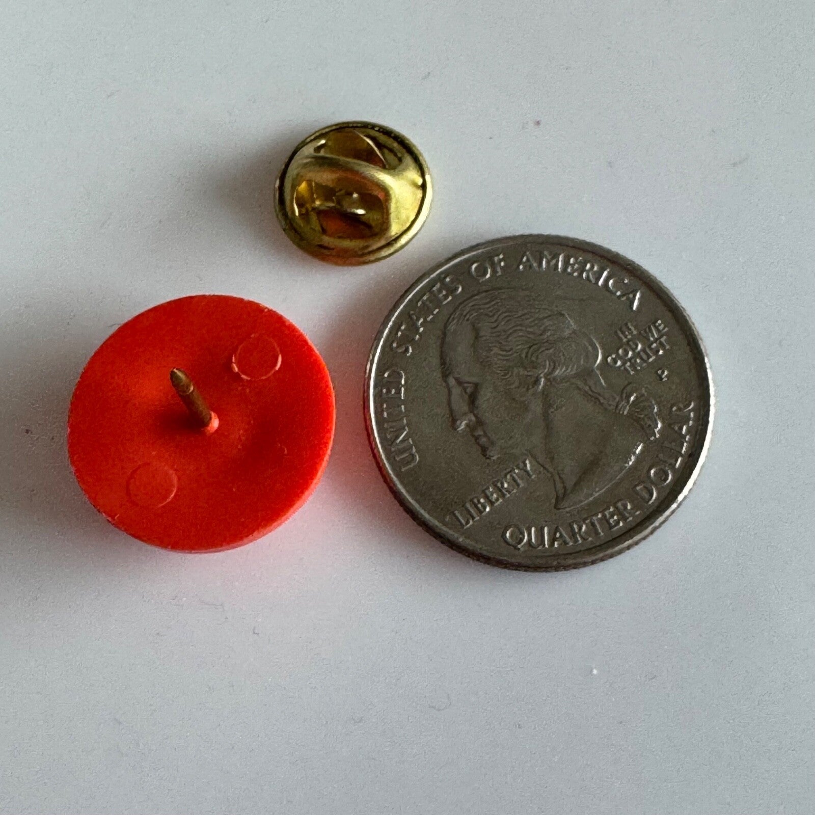 Vtg “Trapped by Brandy” Novelty Clay Target Pin – Funny Orange Lapel Badge
