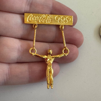 Vintage Gold Tone Coca Cola Mens Gymnastics Rings Olympics Lapel Pin