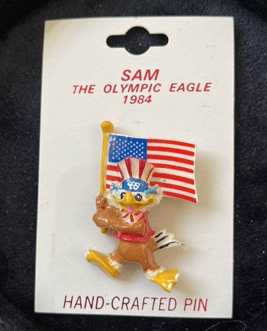 1984 LOS ANGELES SUMMER OLYMPICS SAM THE OLYMPIC EAGLE PLASTIC LAPEL PIN BROOCH