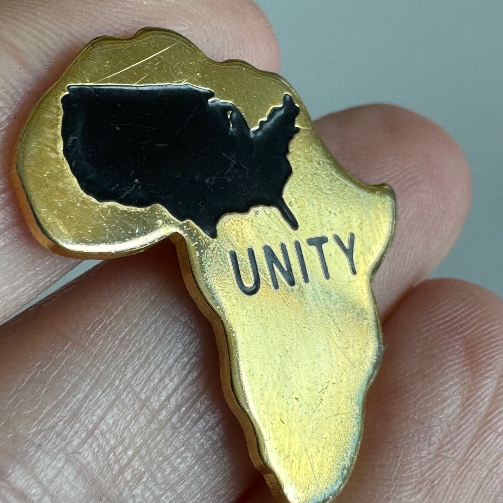 Vintage Africa USA Unity Pin – Gold and Black Solidarity Emblem