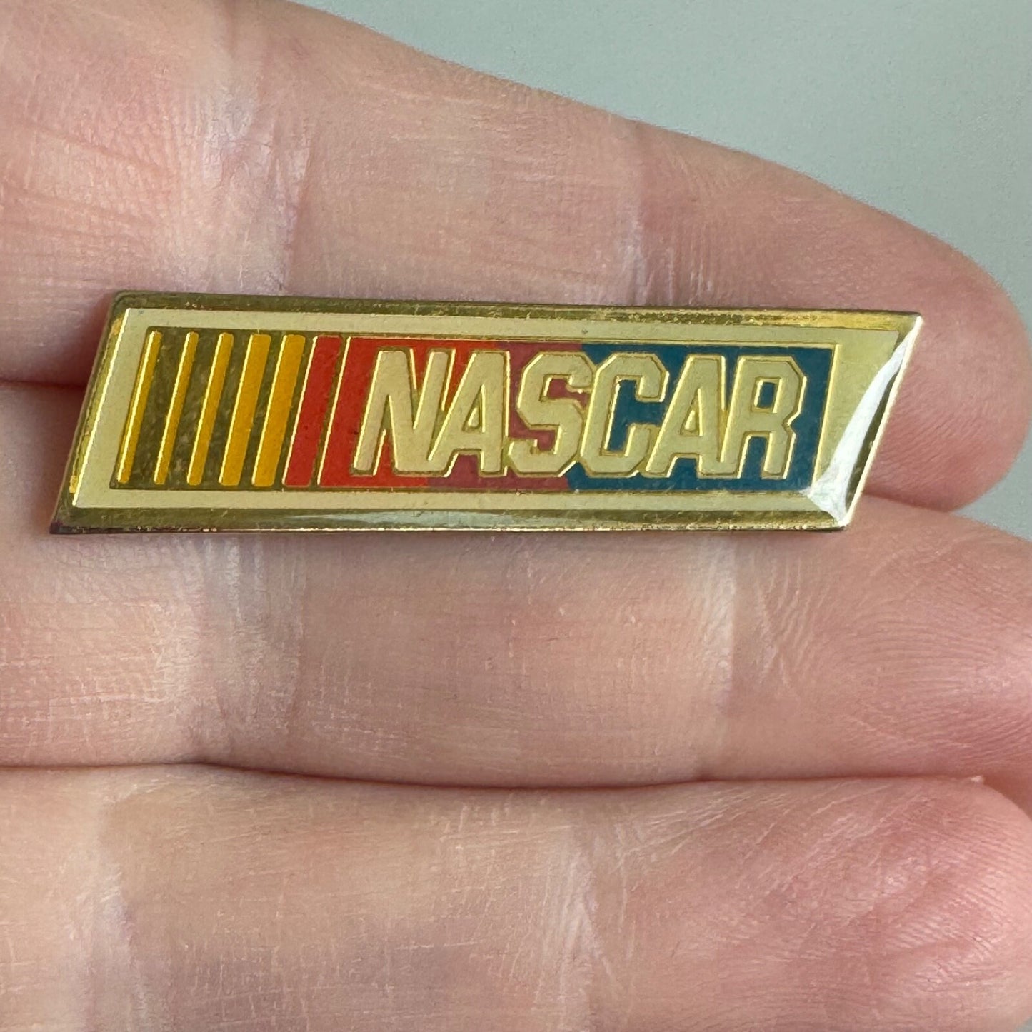 Vintage NASCAR Enamel Pin – Classic Red, Yellow, Blue Racing Logo